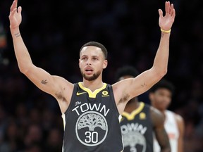 Golden State Warriors forward Stephen Curry celebrates toward fans during the second half of an NBA basketball game against the New York Knicks, Monday, Feb. 26, 2018 in New York. The Warriors defeated the Knicks 125-111.