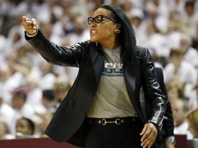 South Carolina head coach Dawn Staley gestures to her players during the first half of an NCAA college basketball game against Mississippi State in Starkville, Miss., Monday, Feb. 5, 2018.
