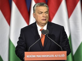 Hungarian Prime Minister Viktor Orban delivers his annual "State of Hungary" speech in Budapest, Hungary, in Budapest, Hungary, Sunday, Feb. 18, 2018. The inscription reads: "For us Hungary is first!"