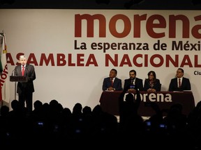 Andres Manuel Lopez Obrador, left, speaks during an event naming him the presidential candidate for the MORENA political party in Mexico City, Sunday, Feb. 18, 2018. On Sunday, Mexico's three major political parties are nominating their presidential candidates for the July 1 election.