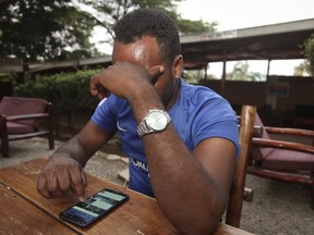 In this Sunday, Feb. 11, 2018, photo, Eritrean migrant Yohannes Tesfagabr, one of the tens of thousands of African migrants Israel has targeted for deportation, recounts his journey to The Associated Press in Kampala, Uganda. His case highlights the predicament of tens of thousands of Africans in Israel who face jail if they do not accept an offer, allegedly without further assurances of safety, to relocate to an unnamed African country.