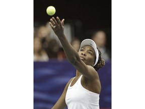 USA's Venus Williams prepares to serve to Netherlands' Richel Hogenkamp during a match in the first round of Fed Cup tennis competition in Asheville, N.C., Sunday, Feb. 11, 2018.