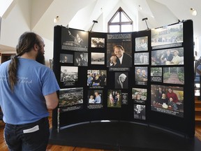 Tracey DeBruhl, of Asheville, N.C., views a memorial display in tribute to the Rev. Billy Graham inside the chapel at the Billy Graham Training Center at the Cove on Wednesday, Feb. 21, 2018, in Asheville. DeBruhl came to pay his respects since he had attended several of Graham's revivals and was inspired by his teachings.