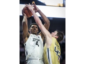 Georgia Tech center Ben Lammers (44) blocks a shot from Wake Forest center Doral Moore (4) during an NCAA college basketball game, Wednesday, Feb. 14, 2018 in Winston-Salem, N.C.