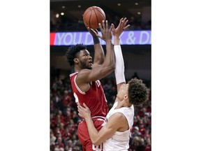 Indiana's Juwan Morgan, left, shoots over Nebraska's Isaiah Roby (15) during the first half of an NCAA college basketball game in Lincoln, Neb., Tuesday, Feb. 20, 2018.