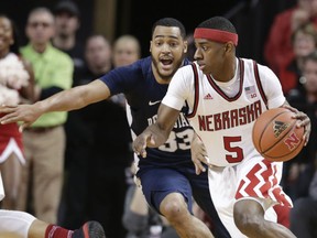 Nebraska's Glynn Watson Jr. (5) tries to drive around Penn State's Shep Garner (33) during the first half of an NCAA college basketball game in Lincoln, Neb., Sunday, Feb. 25, 2018.