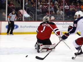 Columbus Blue Jackets center Boone Jenner (38) scores a goal past New Jersey Devils goaltender Keith Kinkaid (1) during the first period of an NHL hockey game Tuesday, Feb. 20, 2018, in Newark, N.J.