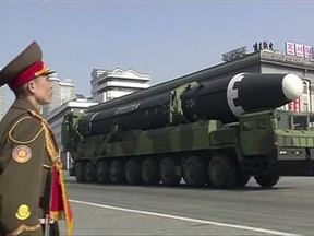 In this image made from video by North Korea's KRT, a military parade is held in Pyongyang, North Korea Thursday, Feb. 8, 2018. North Korea held a massive military parade highlighted by intercontinental ballistic missiles in its capital on Thursday, just one day before South Korea hosts the opening ceremony of the Pyeongchang Winter Olympics.