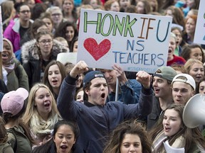 Students from Citadel High School protest outside the legislature in Halifax on Friday, Dec. 2, 2016. The union representing Nova Scotia's 9,300 public school teachers is holding a strike vote today over the Liberal government's education reforms.