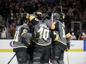 Vegas Golden Knights center Ryan Carpenter (40) celebrates after scoring a goal against the Calgary Flames during the first period of an NHL hockey game Wednesday, Feb. 21, 2018, in Las Vegas.