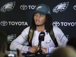 FILE - In this May 12, 2017 file photo, Philadelphia Eagles' Sidney Jones speaks with members of the media during NFL football rookie minicamp at the team's training facility in Philadelphia. A group of fans have helped return  Jones' lost cellphone during the team's Super Bowl victory parade, but not before taking a selfie. Jones was with several of his teammates in Philadelphia on Thursday, Feb. 8, 2018,  as they celebrated the Eagles' 41-33 victory over the favored New England Patriots when his phone reportedly fell out of his back pocket. A photo appeared on the player's verified Instagram page shortly afterward that showed several smiling fans with the caption, "Guess who dropped their phone at the parade!" The fans promised to return it.