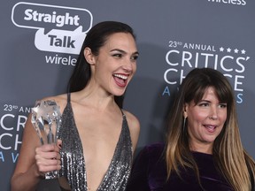 FILE - In this Jan. 11, 2018 file photo, Gal Gadot, left, and Patty Jenkins, winners of the award for best action movie for "Wonder Woman", pose in the press room at the 23rd annual Critics' Choice Awards at the Barker Hangar in Santa Monica, Calif.  The Center for the Study of Women in Television and Film at San Diego State University released its annual "It's a Man's (Celluloid) World" on Thursday, Feb. 22. . It found that females comprised 24 percent of protagonists last year, down from 29 percent in 2016 despite high-profile releases like "Star Wars: The Last Jedi" and "Beauty and the Beast" _ 2017's top two films at the box office.