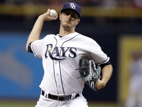 FILE - In this June 19, 2017, file photo, Tampa Bay Rays starting pitcher Jake Odorizzi delivers to the Cincinnati Reds during the first inning of a baseball game in St. Petersburg, Fla. Odorizzi, who turns 28 next month, asked arbitrators Dennis Archer, Phillip LaPorte and Matt Goldberg on Monday, Feb. 12, 2018, for a raise from $4.1 million to $6.3 million. The Rays argued during hearing that he should be paid $6.05 million.