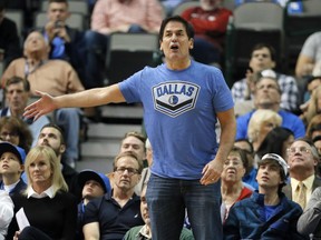 FILE - In this Dec. 14, 2015, file photo, Dallas Mavericks team owner Mark Cuban shouts in the direction of an official during an NBA basketball game against the Phoenix Suns, in Dallas. The Mavericks have hired outside counsel to investigate allegations of inappropriate conduct by former team president Terdema Ussery in a Sports Illustrated report that described a hostile workplace for women. Cuban told the magazine that the team was establishing a hotline for counseling and support services for past and current employees. He is mandating sensitivity training for all employees, himself included.