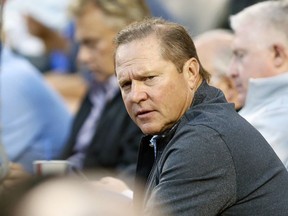 FILE - In this  Tuesday, Aug. 11, 2015, file photo, sports agent Scott Boras attends the baseball game between the Los Angeles Dodgers and Washington Nationals in Los Angeles. Agent Scott Boras says the number of major league teams rebuilding with younger, lower-cost rosters has become a cancer to the sport, attributing behavior to the strengthened luxury tax combining with restraints on draft-pick salaries.