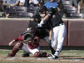 In this photo provided by Santa Clara Athletics, Santa Clara's Jake Brodt bats against Boston College in the seventh inning of an NCAA college baseball game in Santa Clara, Calif., Saturday, Feb. 17, 2018. Notre Dame surprised LSU, Santa Clara's Jake Brodt hit two grand slams in an inning and Southern Mississippi gained a measure of revenge by sweeping Mississippi State during the opening weekend of the college baseball season.