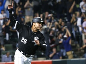 FILE - In this Aug. 23, 2017, file photo, Chicago White Sox's Avisail Garcia celebrates after scoring the game-winning run on a single by Tim Anderson during the ninth inning of a baseball game against the Minnesota Twins, in Chicago. Chicago White Sox outfielder Avisail Garcia is ging to salary arbitration. Garcia requested a hike from $3 million to $6.7 million rather than Chicago's $5.85 million offer.