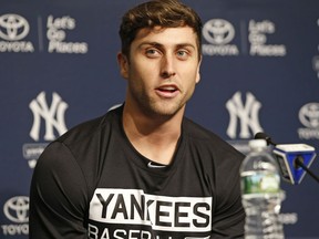 FILE - In this Wednesday, July 5, 2017 file photo, New York Yankees outfielder Dustin Fowler speaks to the media during a press conference at Yankee Stadium in New York. Oakland Athletics center fielder Dustin Fowler has begun doing sliding work at spring training to test his surgically repaired right knee ahead of Oakland's full-squad workouts beginning next week.On June 29, Fowler had not even had his first major league at-bat for the New York Yankees when a freak injury in the first inning of his major league debut ended his year. He needed emergency surgery.