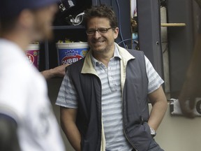 FILE - In this June 3, 2017, file photo, Milwaukee Brewers owner Mark Attanasio a baseball game against the Los Angeles Dodgers, in Milwaukee. Attanasio sets the tone each spring when he addresses the team on the first day of full workouts. The message this year should be upbeat with Milwaukee shifting from rebuilding to contending mode.