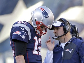 FILE - In this Dec. 4, 2016, file photo, New England Patriots quarterback Tom Brady (12) confers with offensive coordinator Josh McDaniels during the first half of an NFL football game against the Los Angeles Rams, in Foxborough, Mass. Patriots offensive coordinator Josh McDaniels says he's become a much better person and coach for having had a second stint with Tom Brady and Bill Belichick.