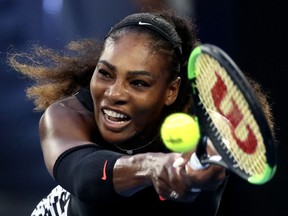 FILE - In this Jan. 28, 2017, file photo, Serena Williams makes a backhand return to her sister Venus during the women's singles final at the Australian Open tennis championships in Melbourne, Australia. Five months after becoming a mother, Serena Williams is ready to return to competitive tennis for the first time since her 2017 Australian Open title. Williams will join her sister Venus in helping the United States begin its Fed Cup title defense Saturday, Feb. 10, 2018, against the Netherlands.