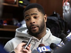 FILE - In this Jan. 25, 2018, file photo, New England Patriots cornerback Malcolm Butler takes questions from reporters in the team's locker room following NFL football practice in Foxborough, Mass. Butler said Tuesday, Feb. 6, 2018, that he didn't miss a curfew or do anything off the field that would have hurt New England's chances of winning the Super Bowl before he was benched for the game.