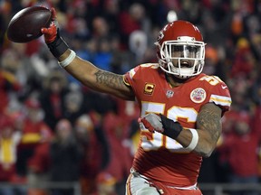 FILE - In this Saturday, Jan. 6, 2018, file photo, Kansas City Chiefs linebacker Derrick Johnson (56) celebrates what he thought was a touchdown on a Tennessee Titans fumble during the second half of an NFL wild-card playoff football game in Kansas City, Mo. Derrick Johnson's tenure with the Kansas City Chiefs is coming to an end. The franchise's career tackles leader and a four-time Pro Bowl selection, Johnson will become a free agent when his contract expires at the start of the new league year March 14, 2018.