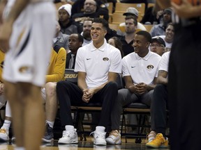 FILE - In this Dec. 5, 2017, file photo, Missouri's Michael Porter Jr. laughs on the bench during the second half of the team's NCAA college basketball game against Miami (Ohio) in Columbia, Mo. Porter is hopeful he'll be cleared to return to practice from lower back surgery next week, providing a boost for a Tigers team aiming to reach the NCAA Tournament. The 6-foot-10 Porter, the top prep prospect in the country last season, played in only two minutes of the Tigers' season-opening win over Iowa State before missing the rest of the season following surgery in November.