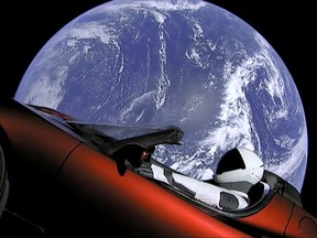 This image from video provided by SpaceX shows the company's spacesuit in Elon Musk's red Tesla sports car which was launched into space during the first test flight of the Falcon Heavy rocket on Tuesday, Feb. 6, 2018. (SpaceX via AP)