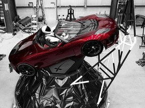 A mannequin "Starman" sits at the wheel of a Tesla Roadster in this photo posted on the Instagram account of Elon Musk, head of auto company Tesla and founder of the private space company SpaceX. The car will be on board when SpaceX launches its new rocket, the Falcon Heavy, from Kennedy Space Center at Cape Canaveral, Fla., scheduled for Tuesday, Feb. 6, 2018. (Courtesy of Elon Musk/Instagram via AP)