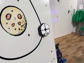 In this Jan. 9, 2018, image made from a video, the Root robot traces a line down a wall using its magnetic treads at the CES gadget show in Las Vegas. Root draws, moves, sees and reacts to touch and various other commands. Kids can use Root to start drawing lines and progress to creating snowflake-like mathematical patterns called fractals.