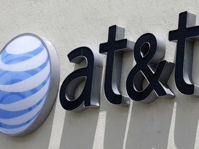 FILE - This July 27, 2017, file photo shows an AT&T logo at a store in Hialeah, Fla. On Monday, Feb. 26, 2018, the 9th U.S. Circuit Court of Appeals said the Federal Trade Commission can indeed punish telecommunications companies for deceptive practices. The FTC still must prove that AT&T was deceptive. The case is over claims that AT&T misled smartphone customers in offering unlimited data plans, but slowing speeds for heavy users.