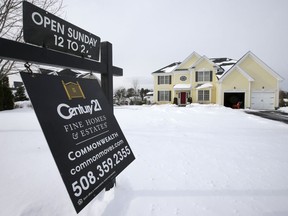 FILE- This Jan. 8, 2018, file, photo shows an existing home for sale in Walpole, Mass. On Thursday, Feb. 15, 2018, Freddie Mac reports on the week's average U.S. mortgage rates.