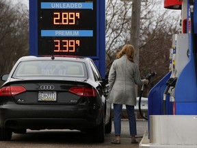 FILE- In this Jan. 22, 2018, file photo, a motorist pumps gas in Bethel Park, Pa. On Thursday, Feb. 15, 2018, the Labor Department reports on U.S. producer price inflation for January.