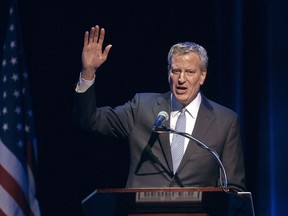 FILE- In this Jan. 29, 2018 file photo, New York City Mayor Bill de Blasio speaks during the "People's State of the Union" event at The Town Hall in New York. De Blasio put his legal troubles behind him a year ago when federal prosecutors said he wouldn't face criminal charges over his campaign fundraising tactics.