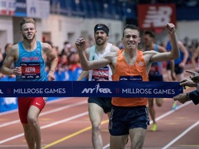 Chris O'Hare, of Britain, crosses the finish line first in the men's Wanamaker Mile during the Millrose Games track and field meet in New York, Saturday, Feb. 3, 2018. Left is Josh Kerr, of Britain, and center is Ben Blankenship, of the United States.