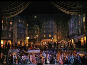 This 2006 image released by Metropolitan Opera shows a scene from Act II of Puccini's "La Bohème," which will be broadcast to movie theaters as part of the Met's Live in HD series on Feb. 24.