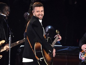 FILE - In this Nov. 4, 2015 file photo, Justin Timberlake performs at the 49th annual CMA Awards in Nashville, Tenn. A watchdog group is politely pleading with Timberlake to keep his Super Bowl halftime show "safe for the children watching." In an open letter to the entertainer issued Tuesday, Jan. 30, 2018, the Parents Television Council hopes there isn't a repeat of what happened in 2004 when Timberlake ripped Janet Jackson's costume to reveal her right breast.