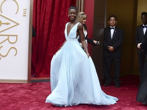 FILE - In this March 2, 2014 file photo, Lupita Nyong'o arrives at the Oscars in Los Angeles. Nyong'o, wearing a light blue Prada gown, won the Oscar for best supporting actress for her role in "12 Years a Slave."