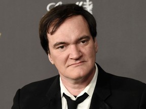 FILE - In this Jan. 10, 2016 file photo, Quentin Tarantino arrives at The Weinstein Company and Netflix Golden Globes afterparty in Beverly Hills, Calif. Tarantino has apologized to Roman Polanski rape victim Samantha Geimer for comments he made in a 2003 radio interview with Howard Stern.