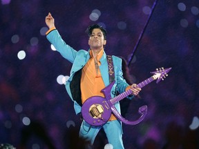 FILE - In this Feb. 4, 2007 file photo, Prince performs during the halftime show at the Super Bowl XLI football game at Dolphin Stadium in Miami. Fans remember Prince for his electrifying halftime performance at the Super Bowl. The "Purple Rain" singer died in 2016, so his followers can only imagine how he might have topped that at this year's game in his hometown of Minneapolis. But music producer Jimmy Jam says Prince is "here in spirit," with sights and sounds all over town in the leadup to the game.