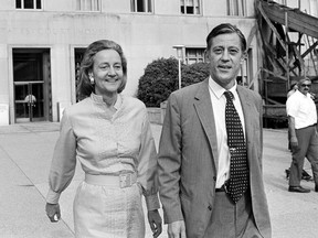 FILE - In this June 21, 1971 file photo, Katharine Graham, left, publisher of The Washington Post, and Ben Bradlee, executive editor of The Washington Post, leave U.S. District Court in Washington after getting the go-ahead to print the Pentagon papers on Vietnam. Later, the U.S. Court of Appeals extended the ban against publishing the secret documents for one day. Graham and Bradlee are portrayed by Meryl Streep and Tom Hanks in the Oscar nominated film "The Post," which deals with the publishing of the Pentagon papers. (AP Photo, File)