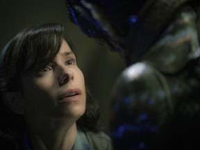 File-This image released by Fox Searchlight Pictures shows Sally Hawkins, left, and Doug Jones in a scene from the film "The Shape of Water."  Ahead of Sunday's 90th Academy Awards, Associated Press film writers Lindsey Bahr and Jake Coyle share their predictions for a ceremony that, at least at the end, should be a nail biter. Best Picture, No controversy, timely messages, a dash of fantasy and a love of movies, "The Shape of Water" seems to be the safe, if a little boring, front runner.
