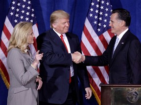 FILE - In this Thursday, Feb. 2, 2012 file photo, Donald Trump greets Republican presidential candidate, former Massachusetts Gov. Mitt Romney, after announcing his endorsement of Romney during a news conference in Las Vegas. Trump is endorsing Romney in Utah's Senate race, another sign that the two Republicans are burying the hatchet after a fraught relationship.