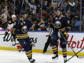 Buffalo Sabres Zemgus Girgensons (28) celebrates his goal with Jacob Josefson (10) during the first period of an NHL hockey game against the Anaheim Ducks, Tuesday, Feb. 6, 2018, in Buffalo, N.Y.