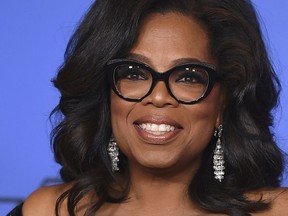 FILE - In this Jan. 7, 2018, file photo, Oprah Winfrey poses in the press room with the Cecil B. DeMille Award at the 75th annual Golden Globe Awards in Beverly Hills, Calif. Winfrey is praising the outspoken students of Parkland, Fla., calling them "warriors of the light." In an interview with The Associated Press on Saturday, Feb. 24, Winfrey drew parallels between the teens and the Freedom Riders of the 1960s, who rode buses into southern states in protest of racial segregation.