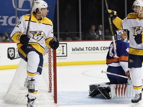 Nashville Predators left wing Kevin Fiala (22) of Switzerland celebrates after scoring a goal on New York Islanders goaltender Jaroslav Halak (41) of Slovakia during the first period of an NHL hockey game in New York, Monday, Feb. 5, 2018.