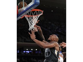 Golden State Warriors forward David West (3) is fouled by New York Knicks center Kyle O'Quinn, right, as he goes up to shoot during the first half of an NBA basketball game, Monday, Feb. 26, 2018 in New York.