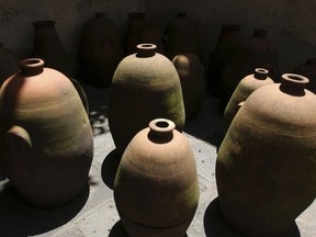 FILE - In this July 13, 2004, file photo, clay pots, used by Mexican farmers to ferment a beverage called Pulque, were placed by architect Luis Barragan in the garden at his home in Mexico City. Visitors will find Barragan's house and studio much the same as it was in 2004 when it was designated a UNESCO World Heritage site for its architectural significance integrating modern, traditional and vernacular elements.