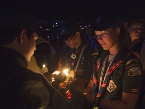This July 27, 2017 photo provided by The Boy Scouts of America shows Venture Scout Hannah Bare, center, who earned the Summit Award of Great Smoky Mountain Council during the Farewell Show of the the 2017 National Scout Jamboree at the Summit Bechtel Reserve near Glen Jean, W.Va.